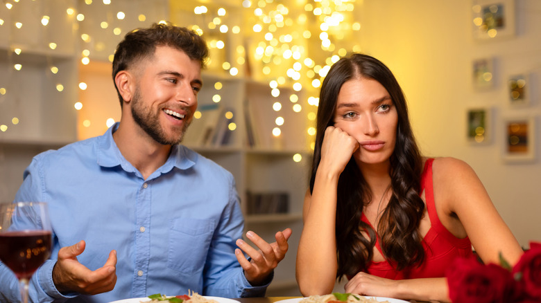 A woman is uninterested in a talking man