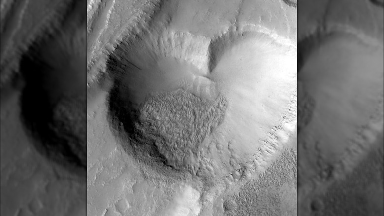 Image taken by the Mars Global Surveyor showing a heart-shaped pit on Mars