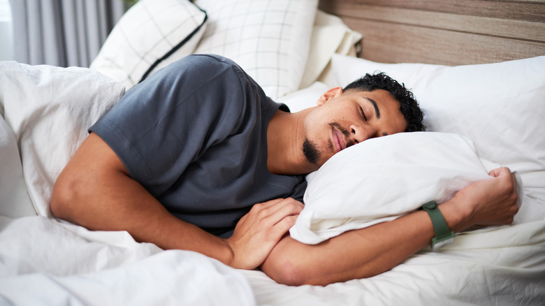 Man sleeping soundly  in bed