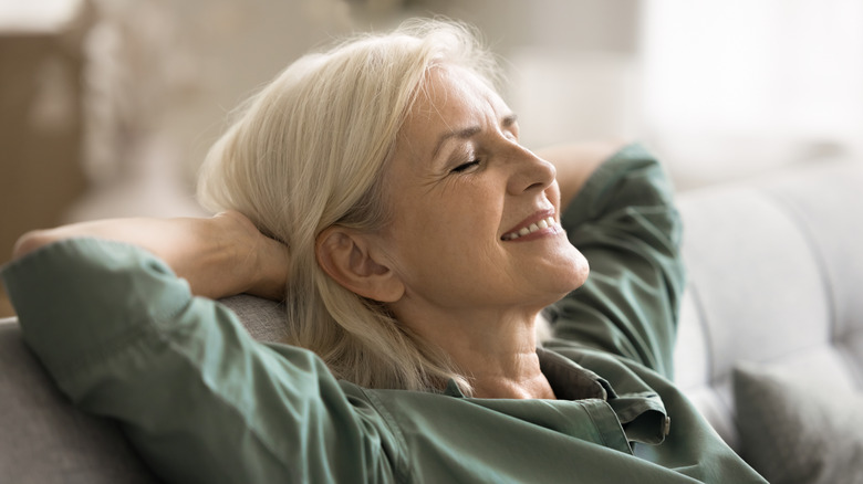 Older woman looking peaceful and happy with eyes closed