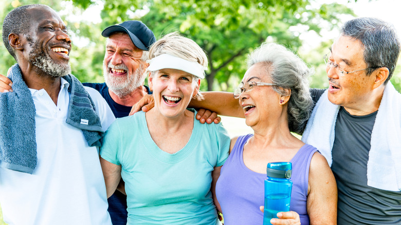 Group of seniors smiling and enjoying exercising
