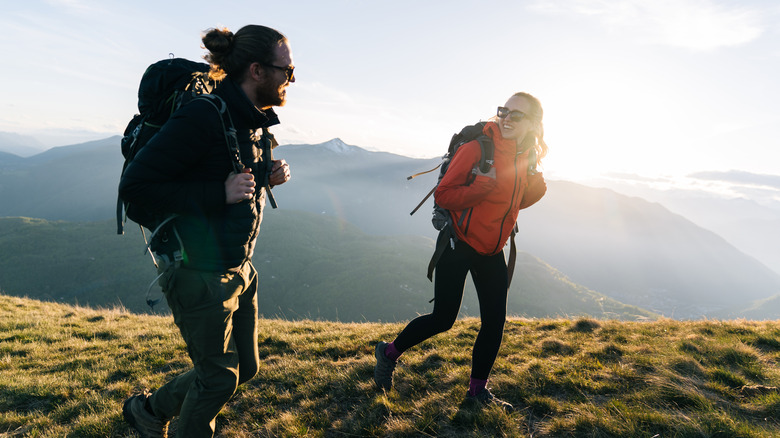 Two people hiking in the sunshine