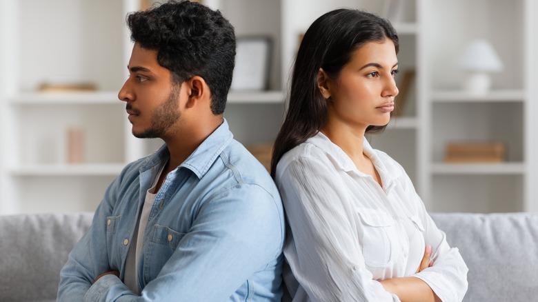 Young couple refusing to speak after a disagreement