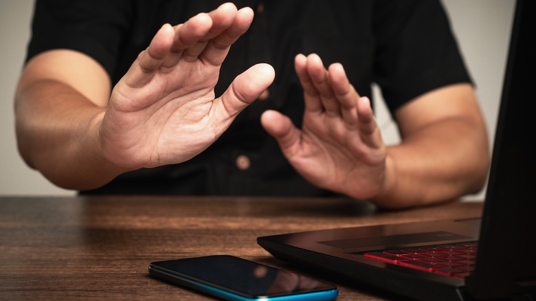 Person refusing to use electronic devices