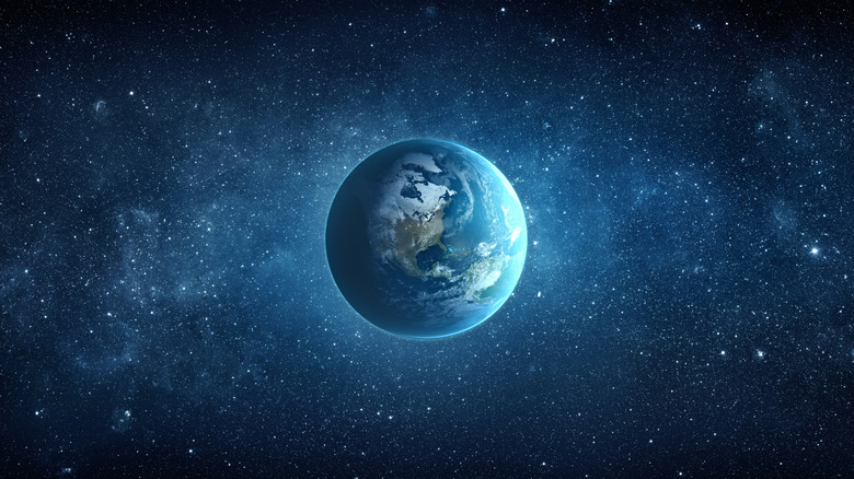 Earth glowing in starry sky