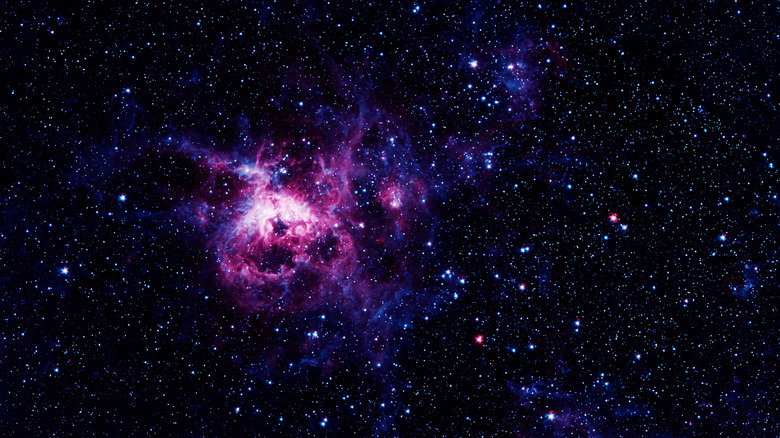 Purple nebula in starry sky
