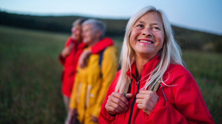 Woman on a hike wearing red jacket
