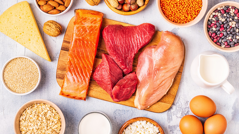 Assortment of protein-rich foods like fish, chicken, eggs, and legumes.