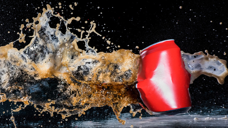Soda can exploding from the sides