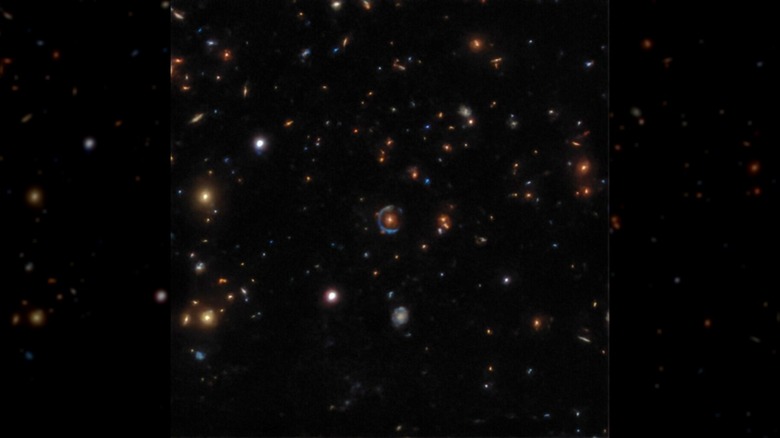 Eight images of gravitational lensing, clusters of galaxies with rings and arcs around them in deep space