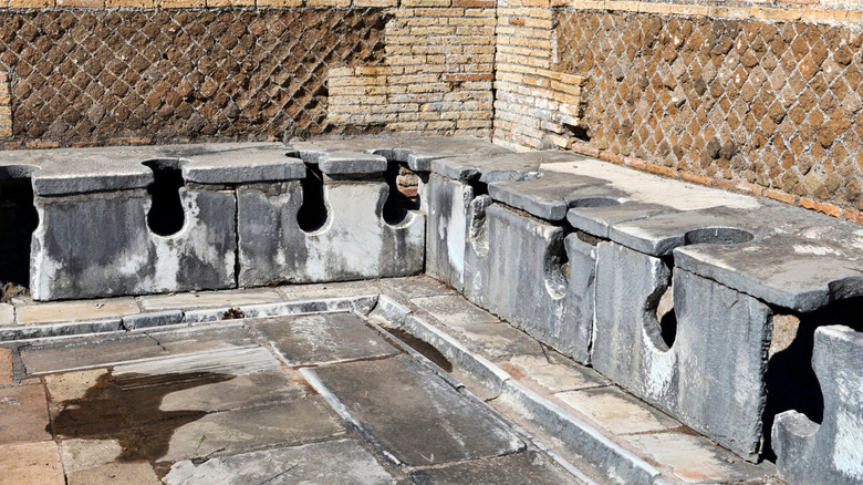 An ancient Roman public bathroom in Ostia Antica, Italy