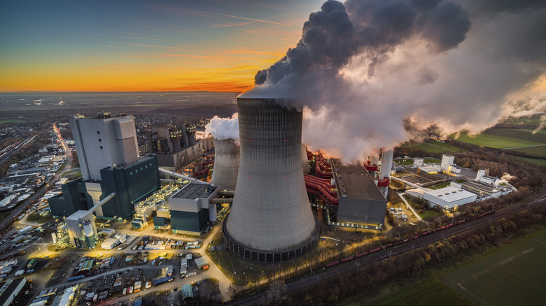 Large cooling tower releases steam in energy plant