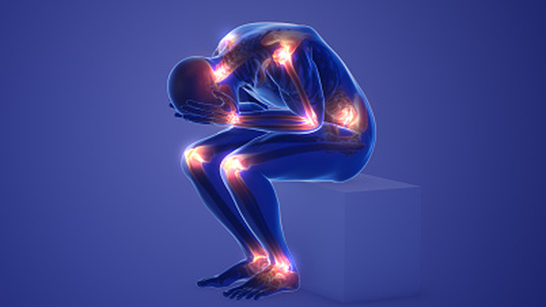 Medical concept of X-ray like person bent over with red indicators of pain locations