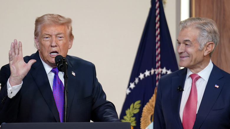Dr. Oz smiling as President Donald Trump gives a speech
