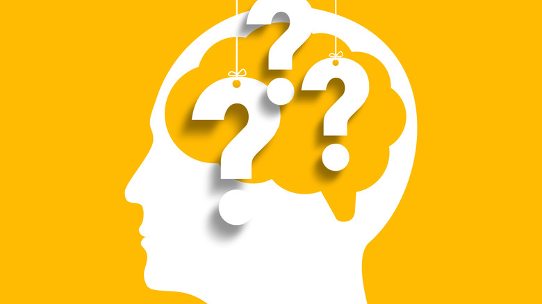 artwork of head full of question marks