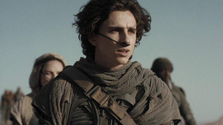 Paul Atreides and other characters wearing stillsuits in Dune