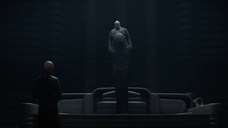 Baron Harkonnen floating above his chair as he talks