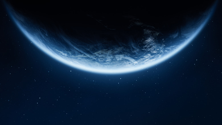 Earth seen from space filling the top half of the frame