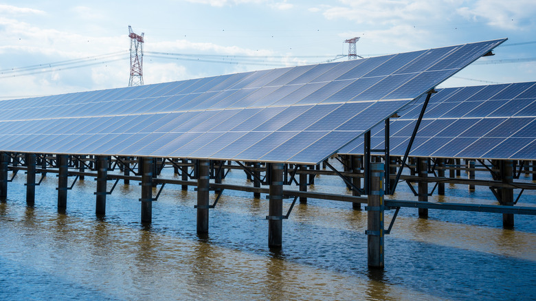 Floating solar panels cast shadows on the water surface