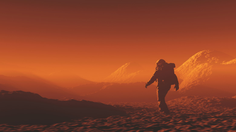 An astronaut is seen exploring the surface of Mars
