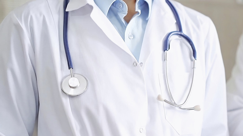 Close-up of doctor wearing a white lab coat with a stethoscope