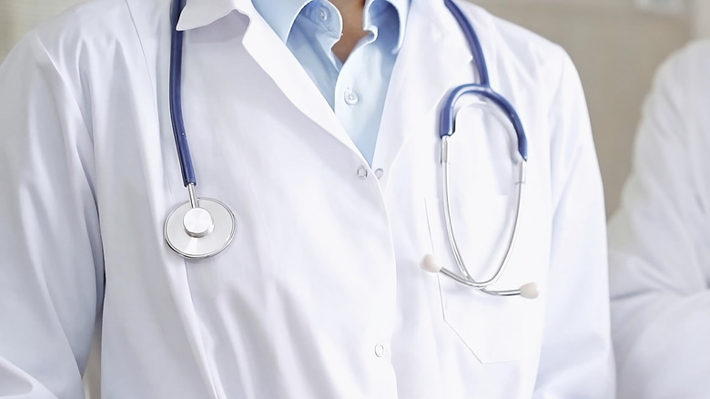 Close-up of doctor wearing a white lab coat with a stethoscope
