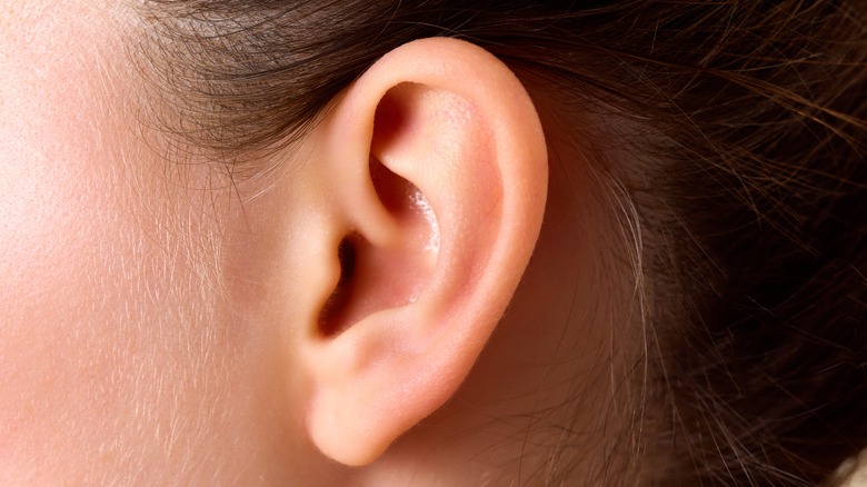 A closeup of a woman's ear