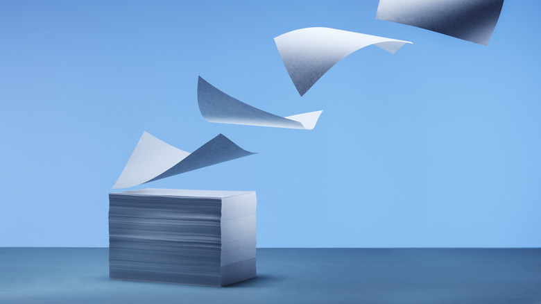 stack of papers blowing away