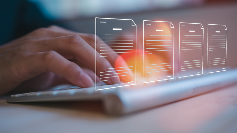 Person typing on a keyboard with document illustrations