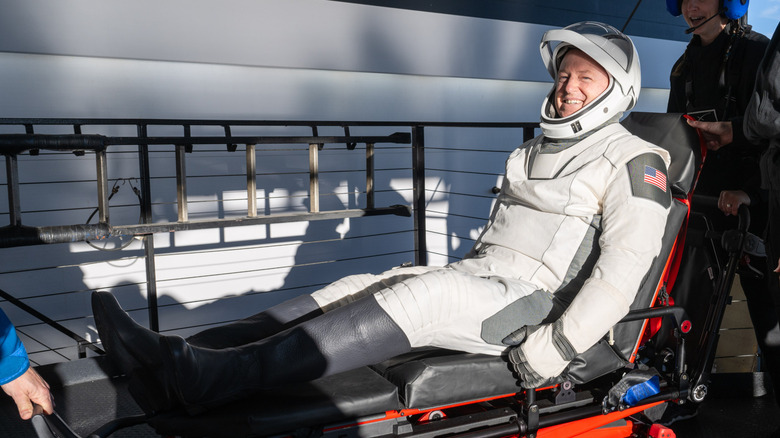 Astronaut Butch Wilmore is helped out of a spacecraft and onto a stretcher in 2025 after nine months in space