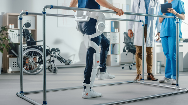 Patient wearing advanced robotic exoskeleton to assist with physical therapy