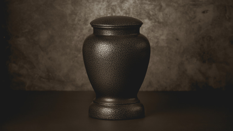 dark colored cremation urn