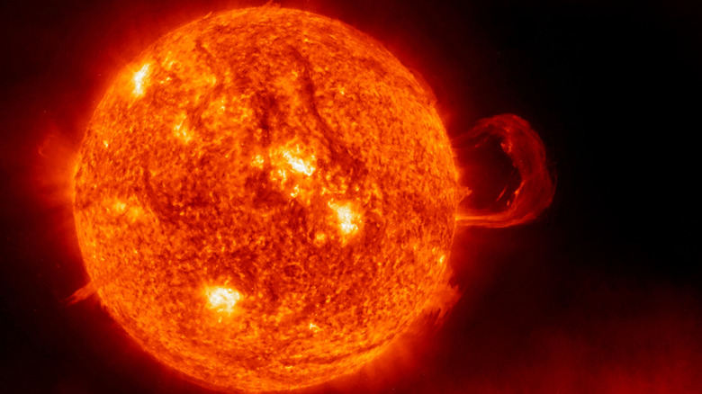 The Sun is seen against a dark background