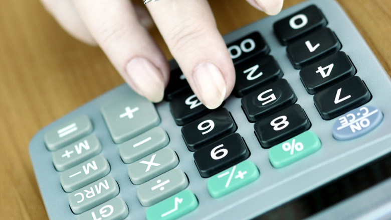 hand using a calculator