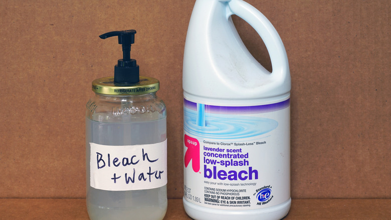 Diluted bleach with large bottle of concentrated bleach beside it