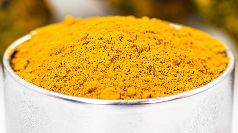 Close-up of an open container of uranium dioxide powder