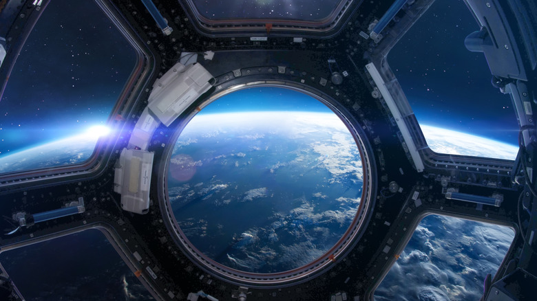 A window from the space station looking down at Earth