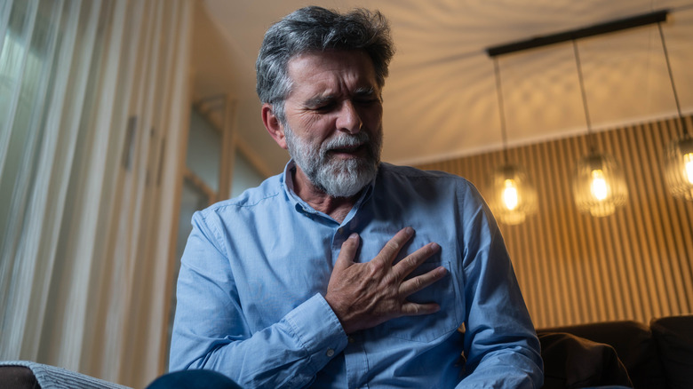 Man clutching his chest in pain