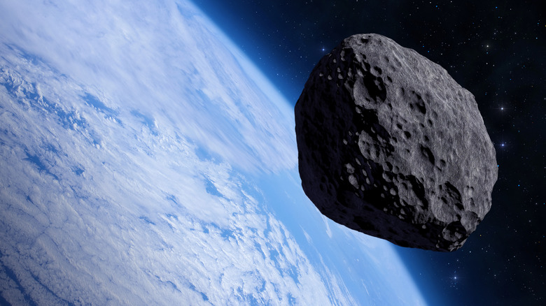 Earth and a large asteroid seen from space