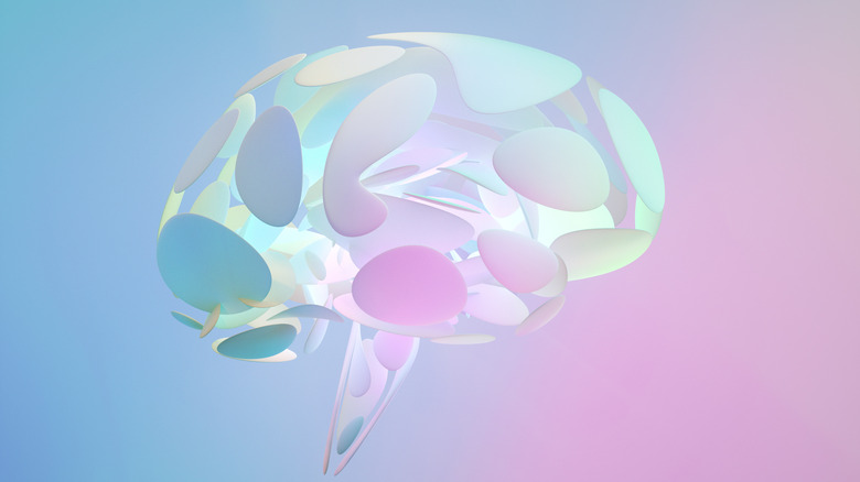 Digital generated image of multicoloured organic shaped brain made out of semi transparent matte plastic against grey background