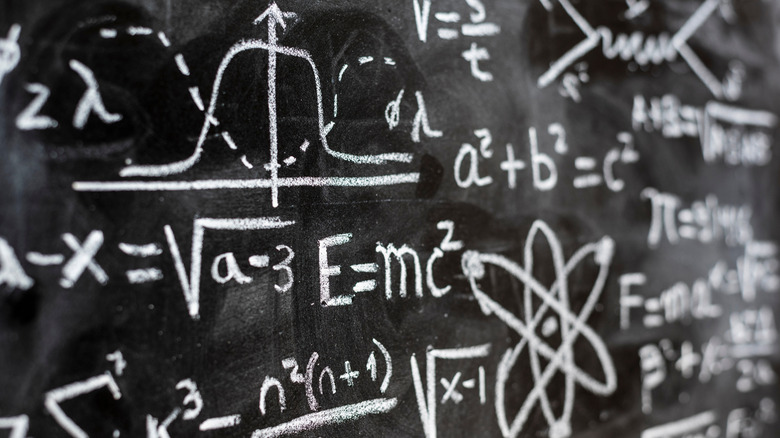 Mathematical formulas written on a chalkboard