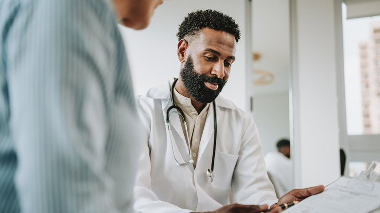 Doctor going over medical test results with a patient