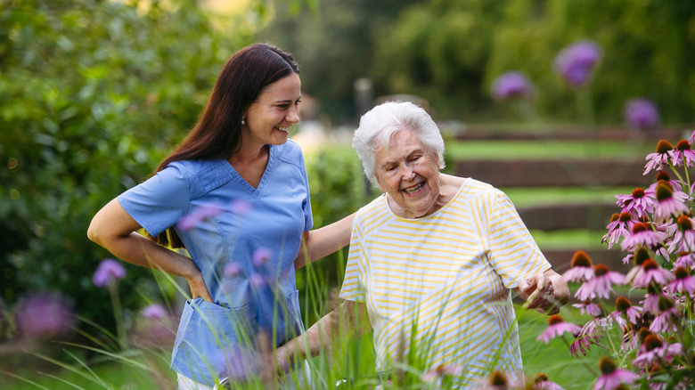 Nurse visiting with elderly woman in a garden