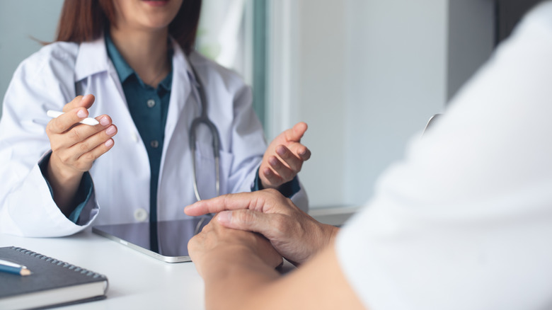 A doctor talking with a patient