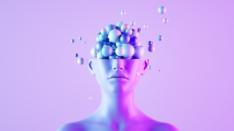 A abstract, digitally generated display of bubbles emerging from a head.