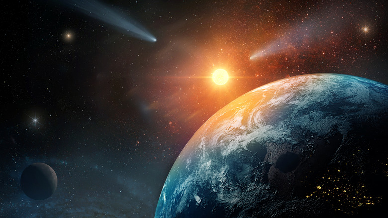 Earth from space with the Sun, visible atmosphere, distant Moon, comets, and stars