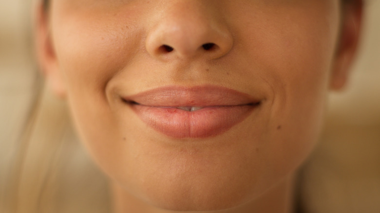 Close up of a person's smiling lips
