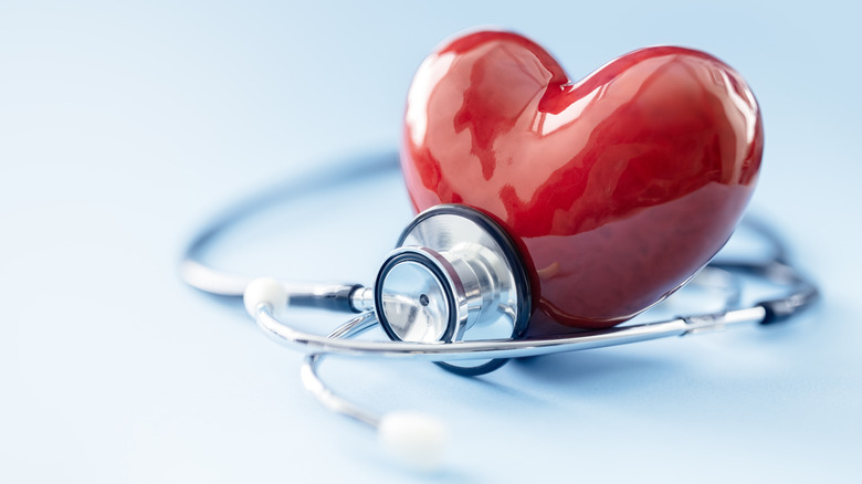 Stethoscope around a red plastic heart