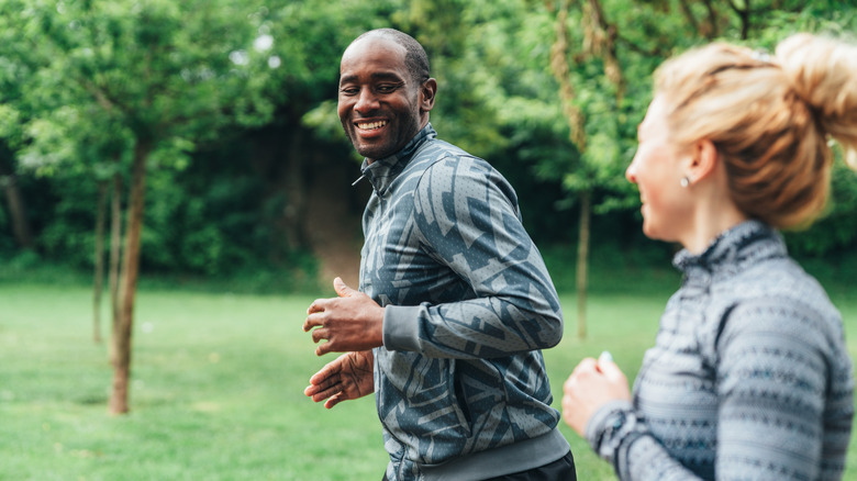 A couple running in the park