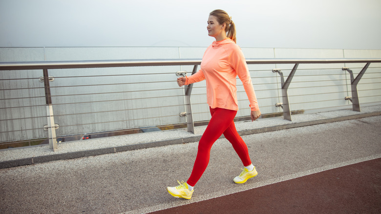 Woman walking fast on an outdoor track